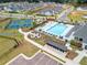 Aerial view of the community pool, tennis court, pool-side furniture, and lounge at 3462 Fishpond Cir, Dacula, GA 30019
