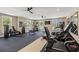 Community gym area with natural light, exercise machines, and ceiling fans to promote an active lifestyle at 3462 Fishpond Cir, Dacula, GA 30019