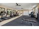 Well-equipped gym with treadmills, elliptical machines, weight benches, and ceiling fans for comfort at 3462 Fishpond Cir, Dacula, GA 30019