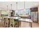 Spacious kitchen with stainless steel appliances, an island, and plenty of countertop space and bar seating at 3462 Fishpond Cir, Dacula, GA 30019