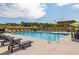 The community pool boasts plenty of lounge chairs, tables, umbrellas, and space for residents to unwind and socialize at 3462 Fishpond Cir, Dacula, GA 30019