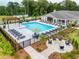 Enjoy the community pool, complete with lounge chairs, a pergola, and a cozy firepit area at 3462 Fishpond Cir, Dacula, GA 30019