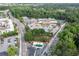 This aerial perspective features the commercial building with surrounding businesses and road access at 3585 Adelaide Xing, Brookhaven, GA 30319