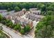Community aerial view showcasing the well-maintained townhomes, lush trees, and neighborhood streets at 3585 Adelaide Xing, Brookhaven, GA 30319
