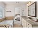 This bathroom has a granite countertop, soaking tub, and overlooks into the bedroom at 3585 Adelaide Xing, Brookhaven, GA 30319