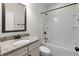 Bathroom features a shower-tub combo with granite countertops at 3585 Adelaide Xing, Brookhaven, GA 30319