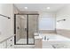 The bathroom includes a tile shower with glass door, soaking tub and granite countertops at 3585 Adelaide Xing, Brookhaven, GA 30319