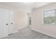 This bedroom has carpet, base trim and a double window overlooking a lush backyard at 3585 Adelaide Xing, Brookhaven, GA 30319