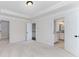 Spacious bedroom has carpet, a tray ceiling, and doors to a closet, bathroom and hall at 3585 Adelaide Xing, Brookhaven, GA 30319