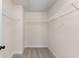 Walk-in closet with carpet and white shelving at 3585 Adelaide Xing, Brookhaven, GA 30319