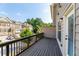 A wooden deck with a view of the neighborhood's townhomes is perfect for relaxation and enjoying the outdoors at 3585 Adelaide Xing, Brookhaven, GA 30319