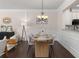Inviting dining area with a modern table and elegant lighting at 3585 Adelaide Xing, Brookhaven, GA 30319