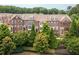 Beautiful exterior view of townhomes with lush landscaping at 3585 Adelaide Xing, Brookhaven, GA 30319