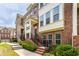 Brick townhome featuring multiple stories and well-maintained landscaping at 3585 Adelaide Xing, Brookhaven, GA 30319