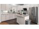 Modern kitchen with white cabinets, stainless steel appliances, and granite countertops at 3585 Adelaide Xing, Brookhaven, GA 30319