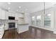 Well-lit kitchen featuring white cabinets, granite countertops, a center island, and stainless steel appliances at 3585 Adelaide Xing, Brookhaven, GA 30319
