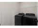 Modern black washer and dryer in the laundry room at 3585 Adelaide Xing, Brookhaven, GA 30319