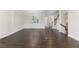 Elegant living room with hardwood floors, wainscoting details, and ample space for comfortable seating arrangements at 3585 Adelaide Xing, Brookhaven, GA 30319