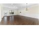 Bright living room with hardwood floors, crown molding, and access to a balcony, perfect for relaxing at 3585 Adelaide Xing, Brookhaven, GA 30319