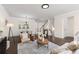 Open-concept living area with hardwood floors and staircase at 3585 Adelaide Xing, Brookhaven, GA 30319
