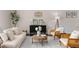 Cozy living room features stylish decor, a comfortable sofa, accent chairs, and a patterned rug at 3585 Adelaide Xing, Brookhaven, GA 30319