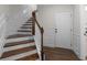 Wooden staircase with white trim and hardwood floor at 3585 Adelaide Xing, Brookhaven, GA 30319