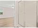 This is a light and airy bedroom with laminate wood flooring and a clear glass shower stall at 3698 Fairlane Nw Dr, Atlanta, GA 30331