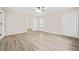 Open bedroom with laminate wood flooring, ceiling fan, and plenty of natural light at 3698 Fairlane Nw Dr, Atlanta, GA 30331