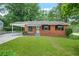 Charming one-story brick home with a carport and well-maintained front lawn at 3698 Fairlane Nw Dr, Atlanta, GA 30331
