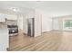 Modern kitchen featuring new stainless steel appliances and sleek white cabinets at 3698 Fairlane Nw Dr, Atlanta, GA 30331