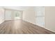 Bright living room featuring wood-look floors, neutral paint, and ample natural light at 3698 Fairlane Nw Dr, Atlanta, GA 30331