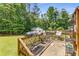 Outdoor living space featuring a grill, dining set, and decorative plants, ideal for entertaining guests at 3835 Annandale Ln, Suwanee, GA 30024