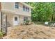 Large stone patio offers ample space for outdoor seating and potted plants, perfect for garden lovers at 3835 Annandale Ln, Suwanee, GA 30024