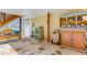 Spacious stone patio with unique vintage cabinets, bench, and a quirky jukebox at 3835 Annandale Ln, Suwanee, GA 30024