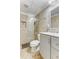 This updated bathroom features a walk-in shower with neutral tile and an updated vanity at 3835 Annandale Ln, Suwanee, GA 30024