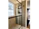 Modern bathroom shower featuring sleek glass doors, tiled walls, and convenient built-in shelving niches at 3835 Annandale Ln, Suwanee, GA 30024