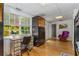 This bonus room offers a built-in desk and cabinet and hardwood floors, allowing for multiple uses at 3835 Annandale Ln, Suwanee, GA 30024