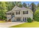 Charming two-story home featuring a welcoming entryway, neutral siding, and a well-maintained front yard surrounded by mature trees at 3835 Annandale Ln, Suwanee, GA 30024