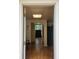 View of a well-lit home foyer leading to a staircase and a glimpse of the outdoors at 3835 Annandale Ln, Suwanee, GA 30024