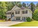 View of the traditional two-story home with vinyl siding and well-maintained front lawn at 3835 Annandale Ln, Suwanee, GA 30024