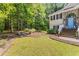 Landscaped front yard with mature trees providing shade and natural beauty to the property at 3835 Annandale Ln, Suwanee, GA 30024