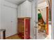Hallway showcasing built-in closet and drawer space, with a view to the outdoors at 3835 Annandale Ln, Suwanee, GA 30024