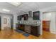 Contemporary kitchen with sleek dark cabinetry, stainless steel appliances, and stylish backsplash at 3835 Annandale Ln, Suwanee, GA 30024