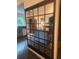 Open floor plan reflecting the living room through a mirrored partition, showcasing its modern decor at 3835 Annandale Ln, Suwanee, GA 30024