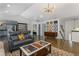 Inviting living room, offering versatile space and a seamless connection to the adjacent kitchen and bedroom at 3835 Annandale Ln, Suwanee, GA 30024