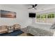 Bright main bedroom with calming decor, a ceiling fan, and a large window for natural light at 3835 Annandale Ln, Suwanee, GA 30024