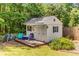 Charming backyard shed with a small deck and outdoor seating at 3835 Annandale Ln, Suwanee, GA 30024