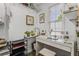 This walk-in closet is well lit and offers a vanity with drawers and shelves, as well as room to store clothes at 3835 Annandale Ln, Suwanee, GA 30024