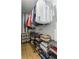 This walk-in closet features custom shelving and ample space for organization and storage of clothes and accessories at 3835 Annandale Ln, Suwanee, GA 30024