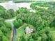 Secluded home surrounded by lush greenery and lake access, offering a peaceful retreat at 100 Chantilly Ln, Fayetteville, GA 30215